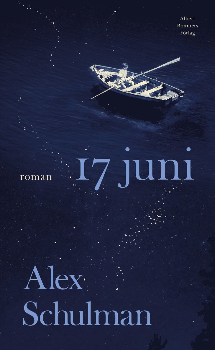 En man som ror en eka på ett mörkt hav